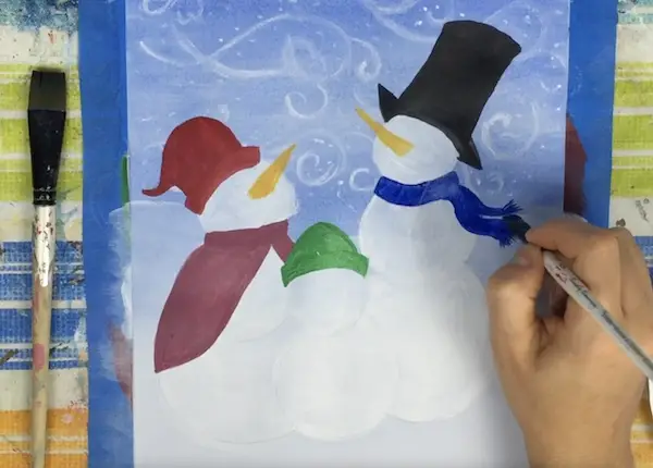 4. Trace and paint in the snowman carolers